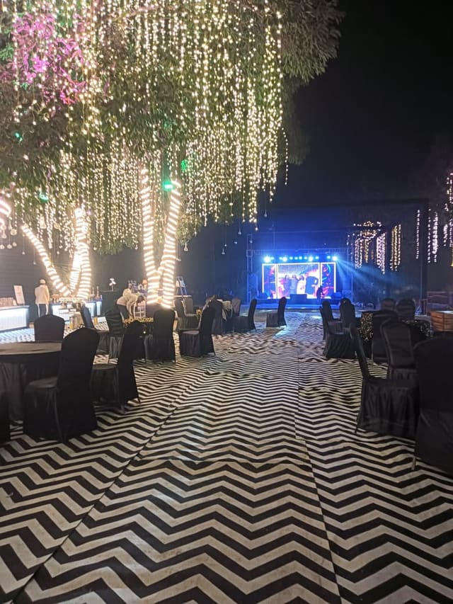 Fairy-lit dining setup styled for an evening social event