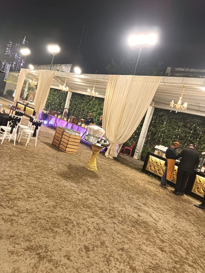 Guests walking the decorated evening pathway