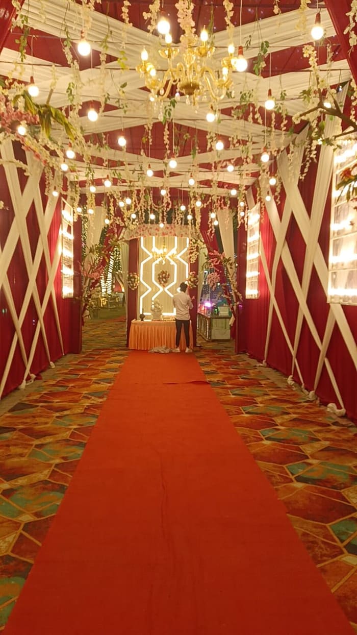 Red carpet grand entrance with floral chandelier