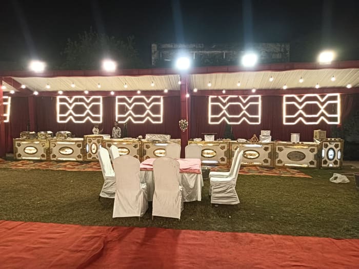 Red and gold tent decor styled for a stage