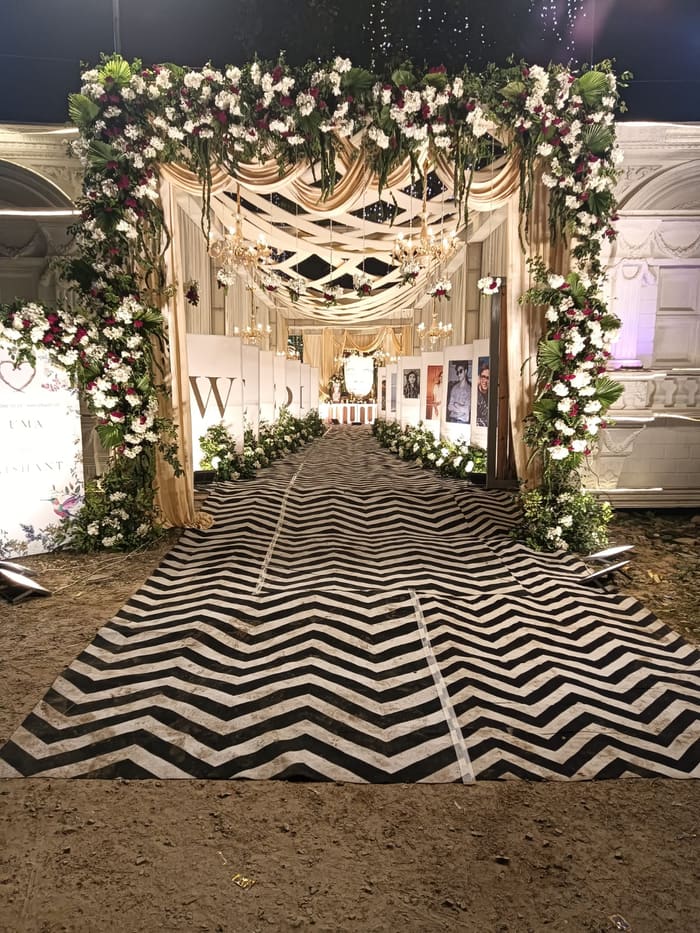 Floral wedding arch with monogram lettering